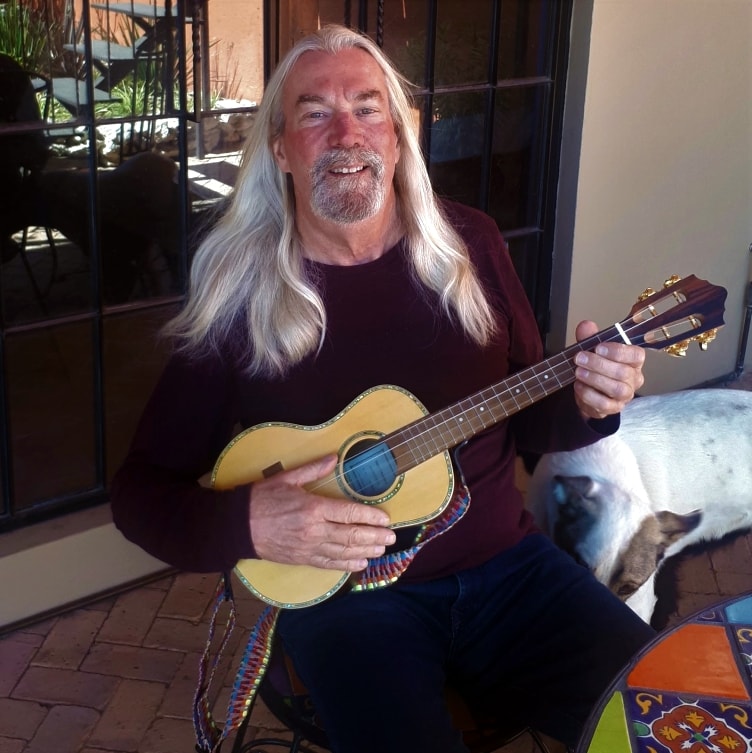 John holding a ukulele